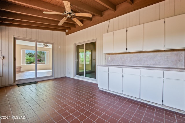 interior space with ceiling fan