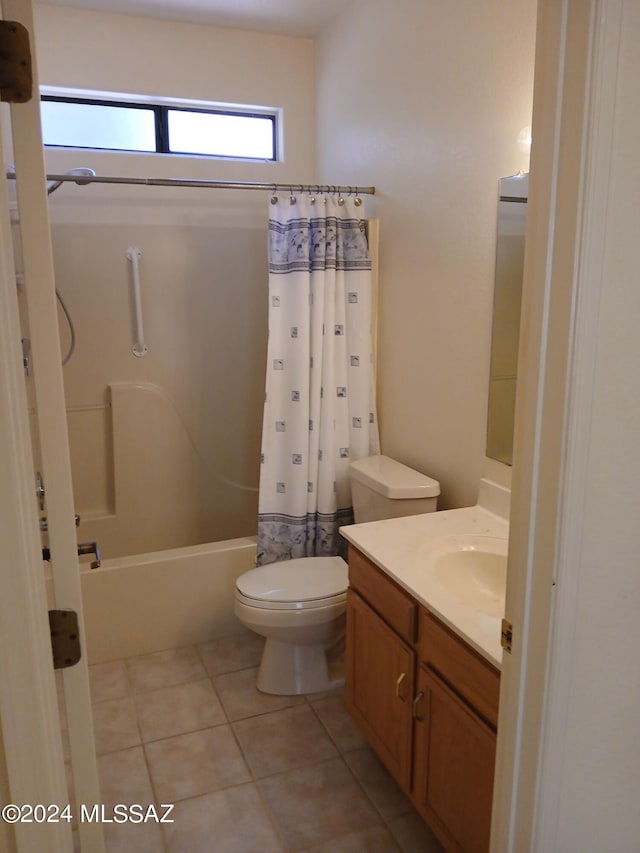 full bathroom featuring shower / bath combination with curtain, vanity, toilet, and tile patterned floors