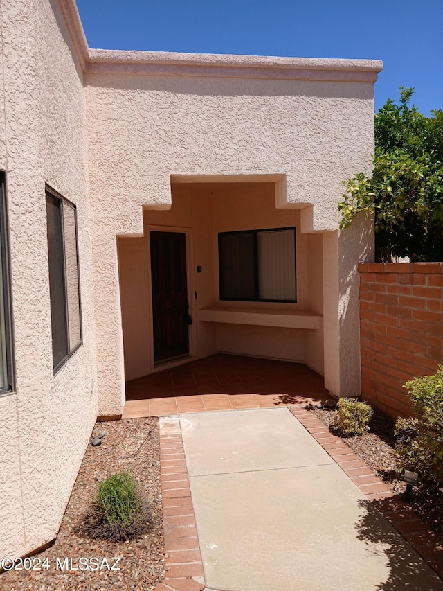 doorway to property featuring a patio