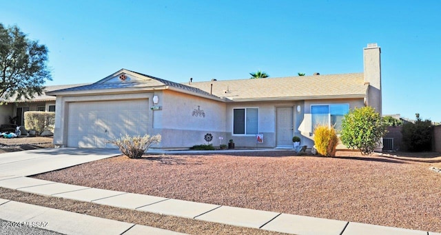 ranch-style home featuring a garage