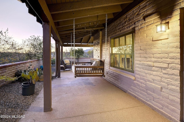 patio terrace at dusk with an outdoor living space