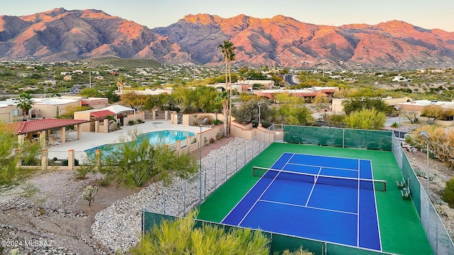 view of sport court with a mountain view