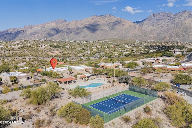 birds eye view of property with a mountain view