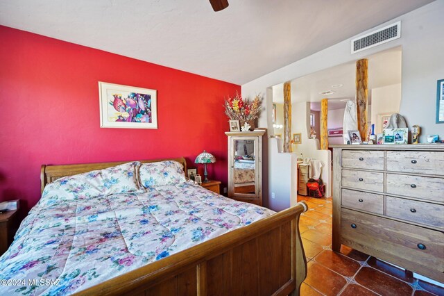 bedroom featuring tile patterned floors and ceiling fan