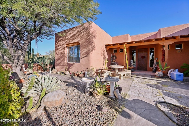 view of front of property featuring a patio