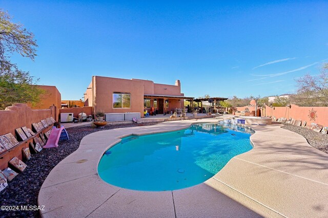 view of swimming pool featuring a patio area