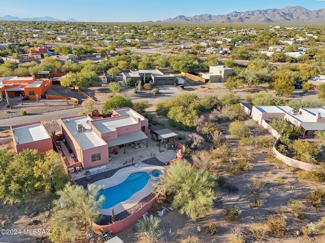 birds eye view of property with a mountain view