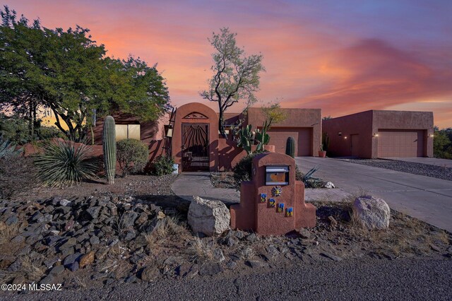 adobe home featuring a garage