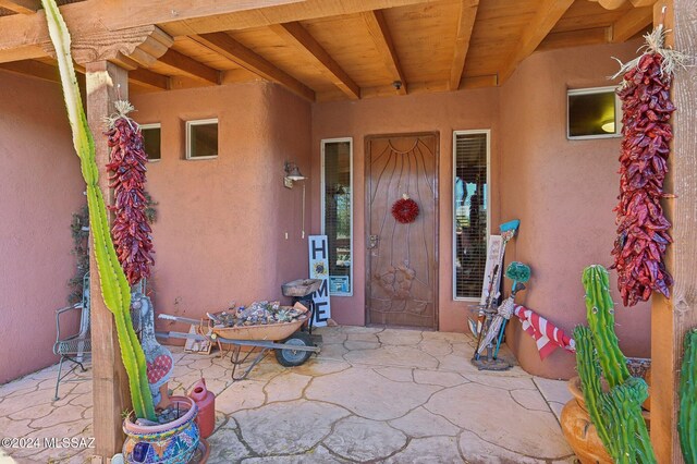 entrance to property with a patio