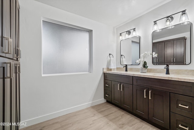 bathroom featuring hardwood / wood-style floors and vanity