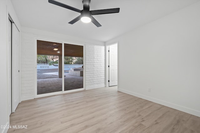 spare room with light hardwood / wood-style floors and ceiling fan