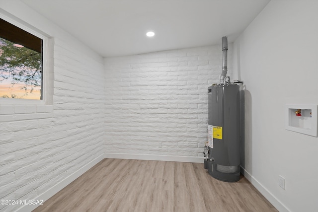 utility room featuring gas water heater