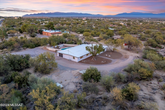 aerial view at dusk with a mountain view