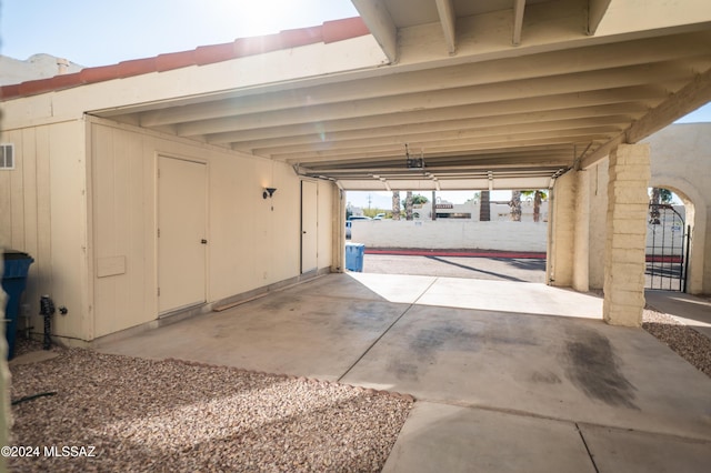 garage featuring a carport