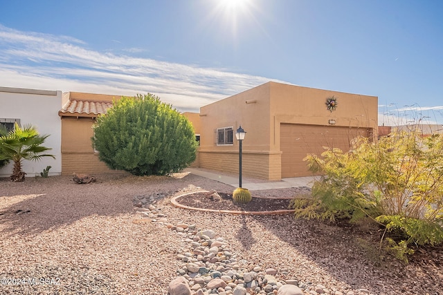 view of property exterior with a garage