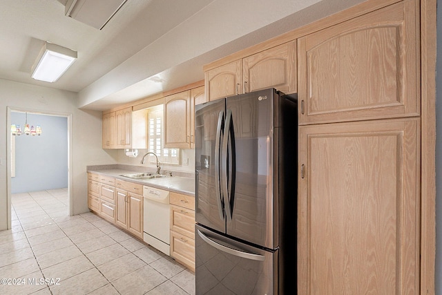 kitchen with light brown cabinets, sink, stainless steel fridge with ice dispenser, white dishwasher, and light tile patterned flooring