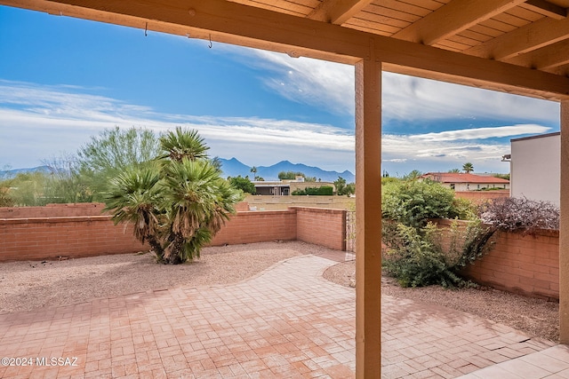 view of patio / terrace featuring a mountain view