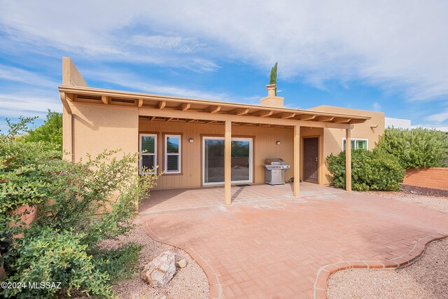 back of property with a patio area