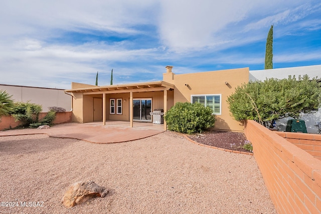 rear view of house with a patio area