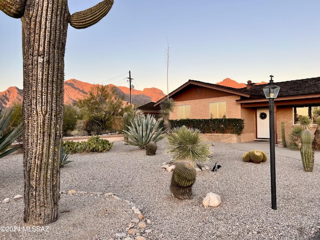 ranch-style home with a mountain view