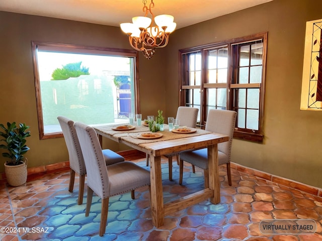 dining area with an inviting chandelier and a healthy amount of sunlight