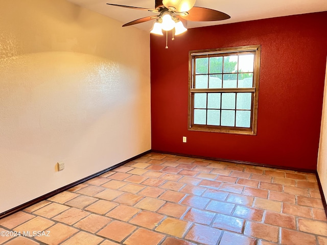 unfurnished room with ceiling fan