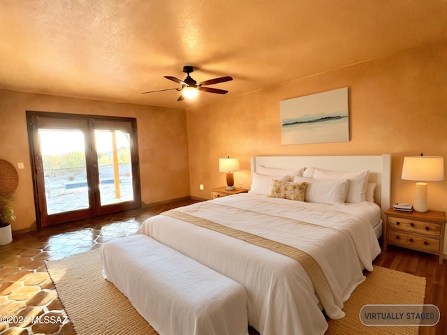 bedroom featuring access to exterior, french doors, a textured ceiling, ceiling fan, and hardwood / wood-style flooring