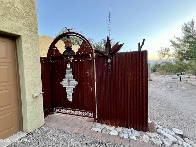 view of gate at dusk