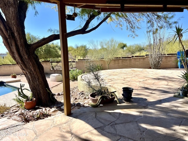 view of patio featuring a fenced in pool