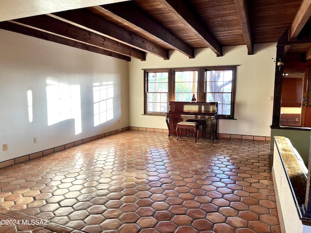 interior space featuring tile patterned flooring, beam ceiling, and wood ceiling