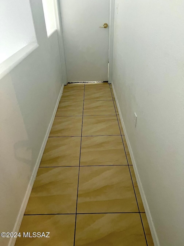 corridor featuring tile patterned flooring