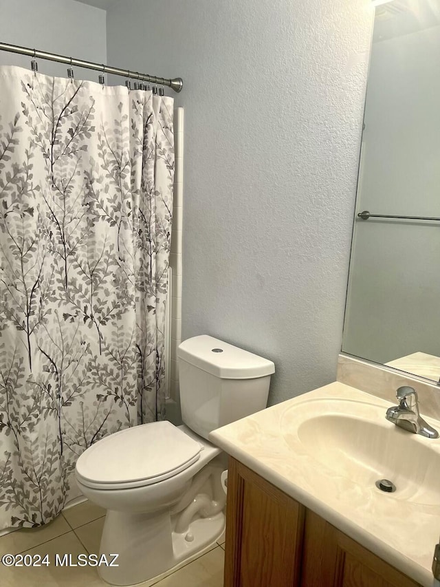 bathroom featuring tile patterned flooring, vanity, toilet, and a shower with curtain