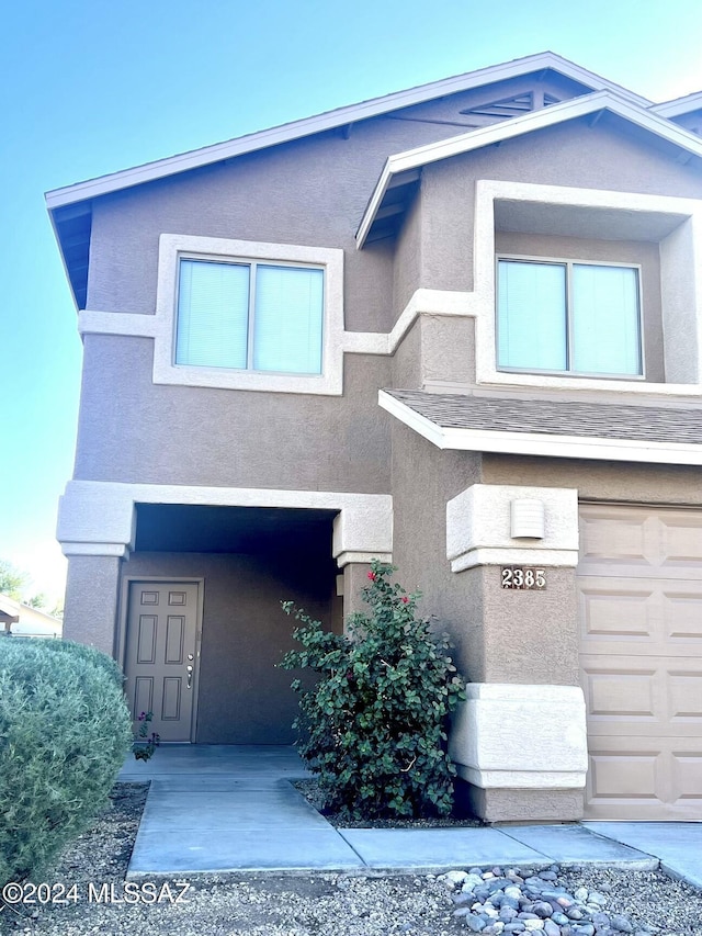 view of front of property with a garage