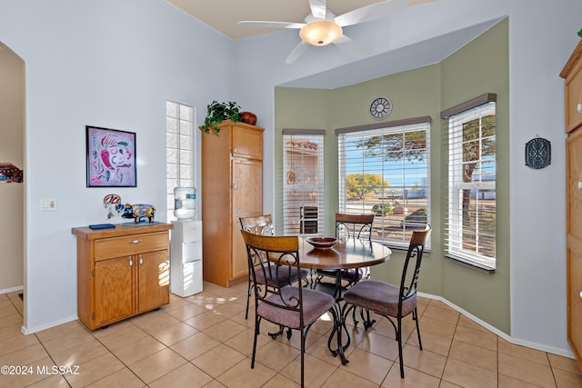 dining area with ceiling fan and light tile patterned floors