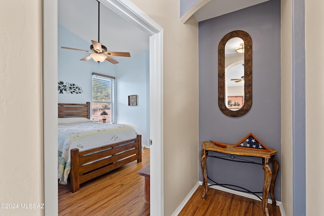 bedroom with hardwood / wood-style flooring and ceiling fan