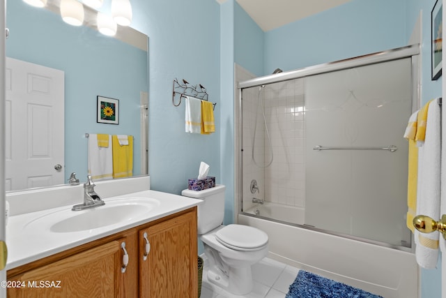 full bathroom with tile patterned flooring, vanity, toilet, and shower / bath combination with glass door