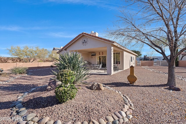 rear view of house featuring a patio