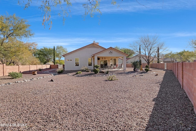 back of house with a patio area