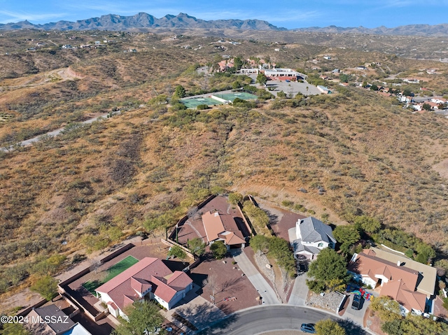 birds eye view of property with a mountain view