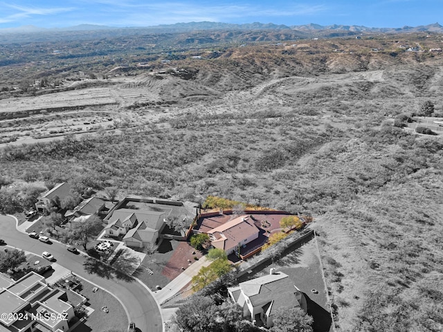 birds eye view of property featuring a mountain view