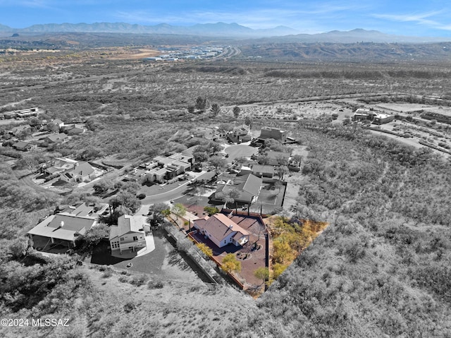 birds eye view of property with a mountain view