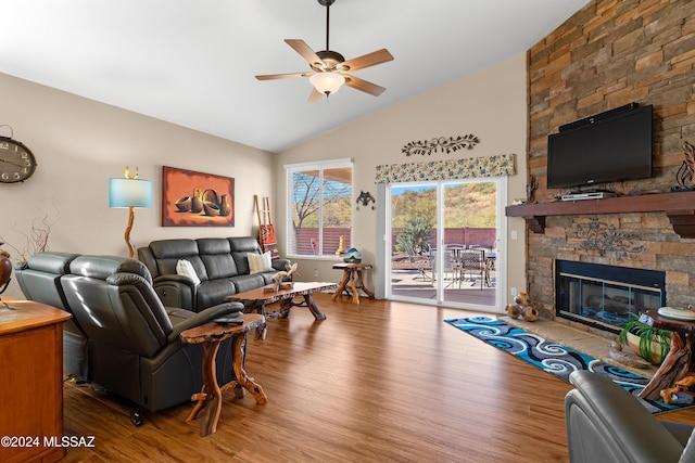 living room featuring a fireplace, wood-type flooring, ceiling fan, and lofted ceiling