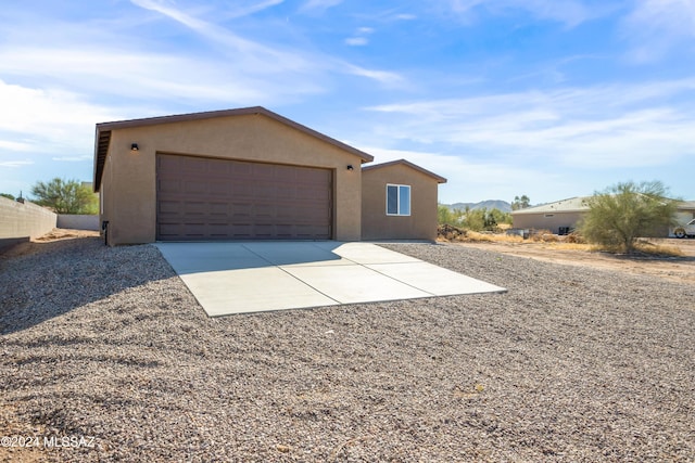 single story home featuring a garage