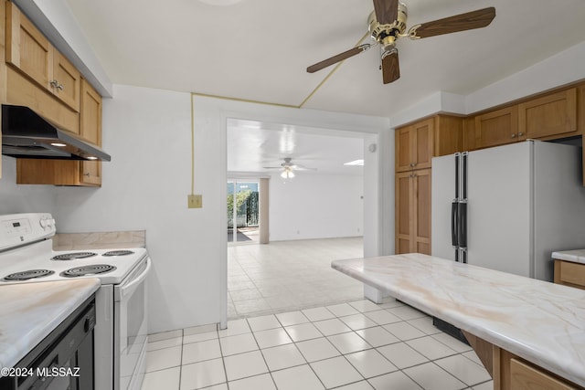 kitchen with light tile patterned floors, white appliances, and ceiling fan