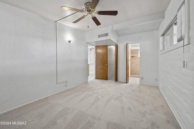 unfurnished room with ceiling fan and light colored carpet