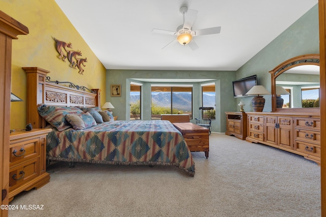 carpeted bedroom featuring ceiling fan and lofted ceiling