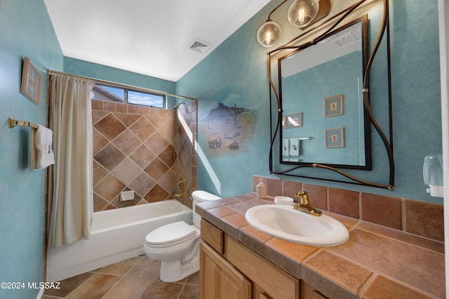 full bathroom featuring toilet, vanity, and shower / bath combo with shower curtain