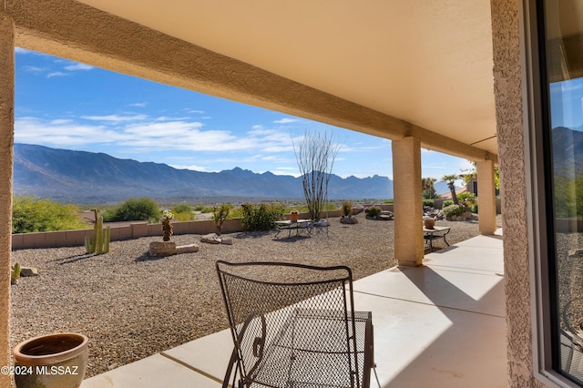 view of patio / terrace with a mountain view