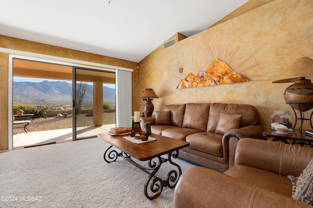 living room featuring a mountain view and vaulted ceiling