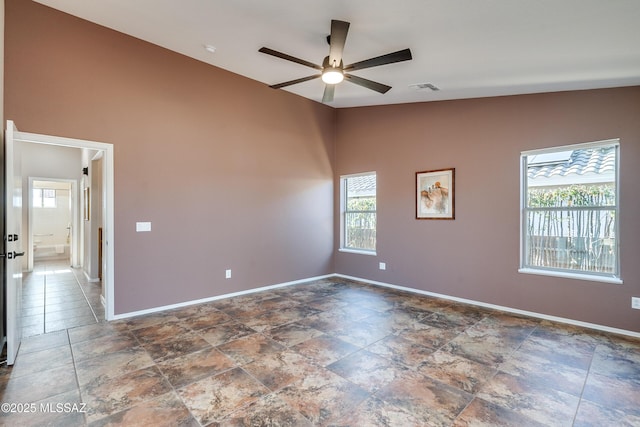 unfurnished room featuring ceiling fan and lofted ceiling